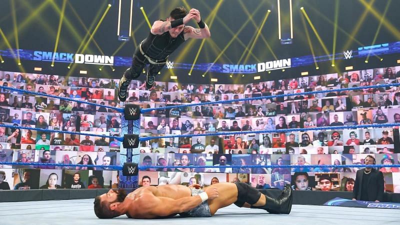 Dominik Mysterio putting Robert Roode down